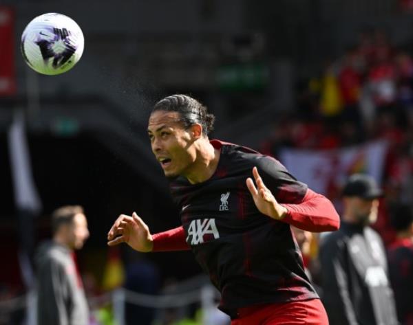 Virgil van Dijk heads the ball