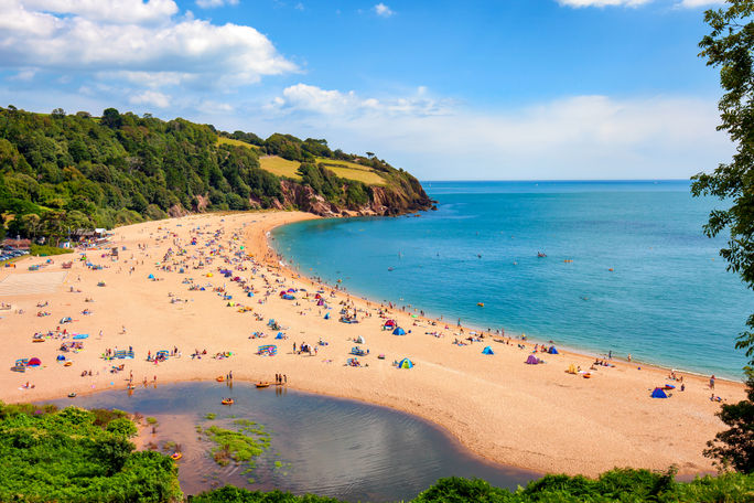 People enjoying the Blackpool Sands beach near Dartmouth in Devon, England. 